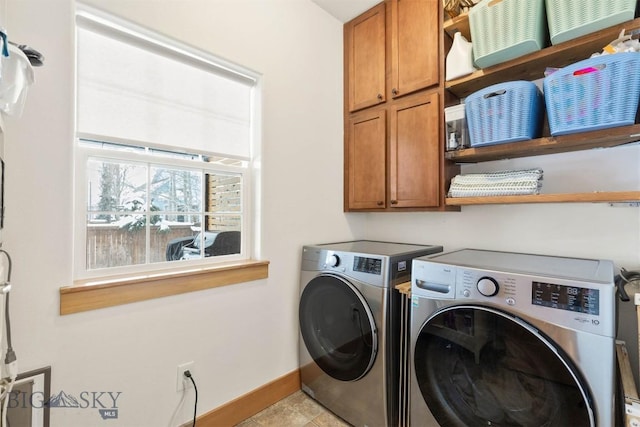 washroom featuring light tile patterned flooring, cabinets, and separate washer and dryer