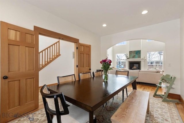 dining space with light hardwood / wood-style flooring