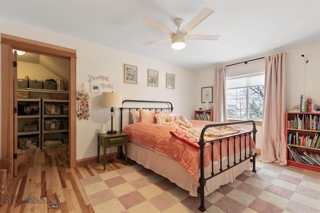 bedroom with ceiling fan and light hardwood / wood-style flooring