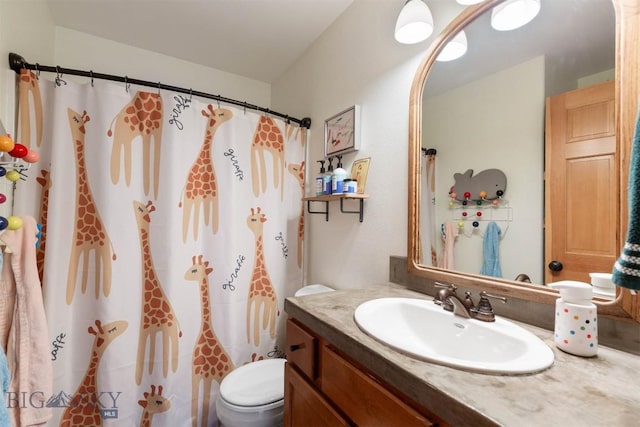 bathroom with toilet, vanity, and a shower with curtain