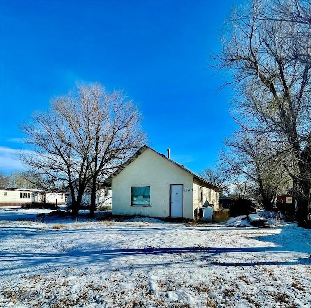 view of snow covered property