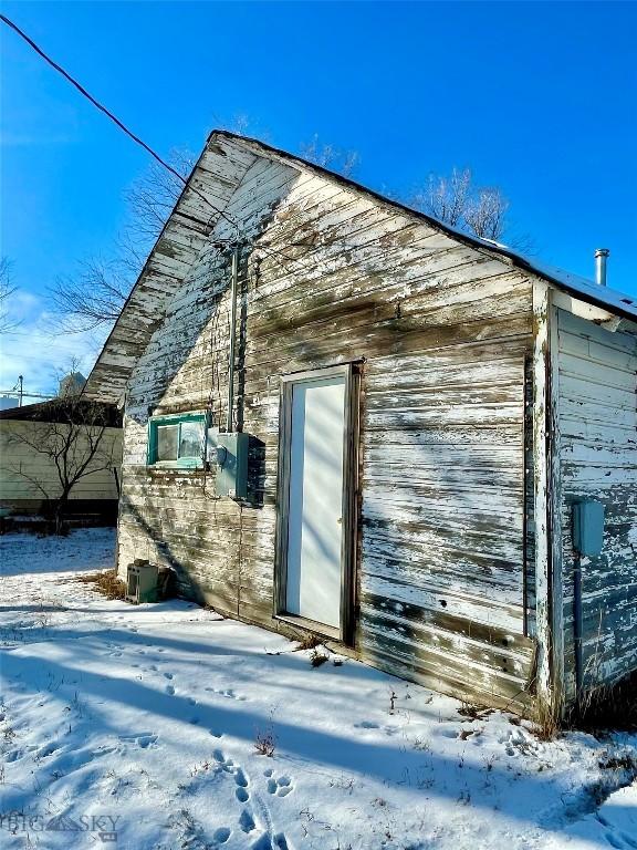 view of snow covered property