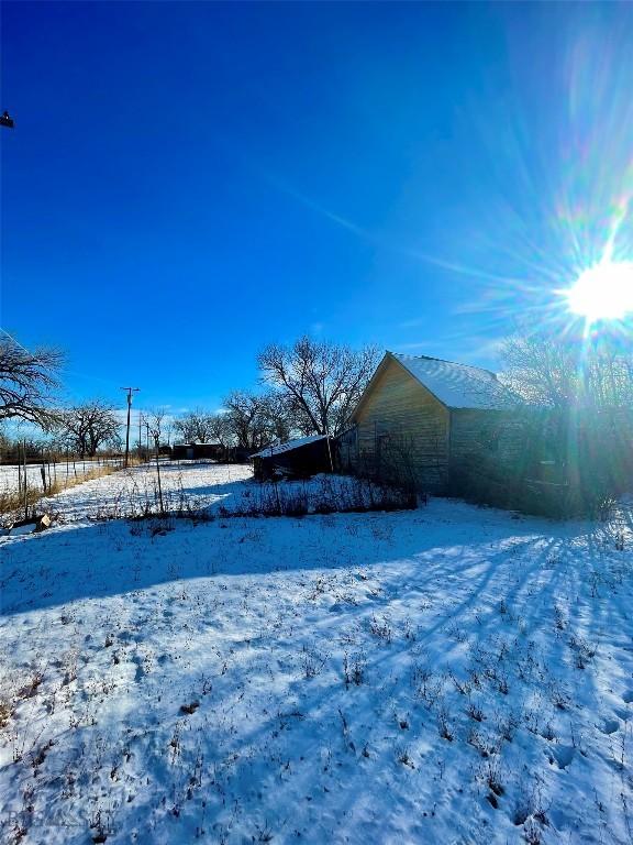 view of yard covered in snow