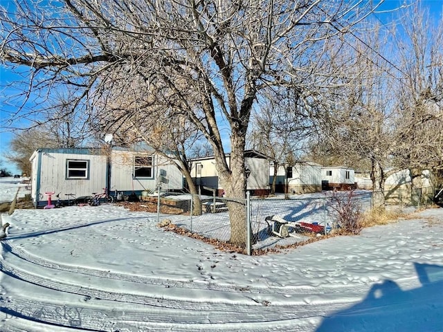 snowy yard with fence