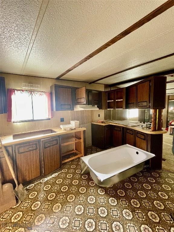 kitchen featuring light countertops and a textured ceiling