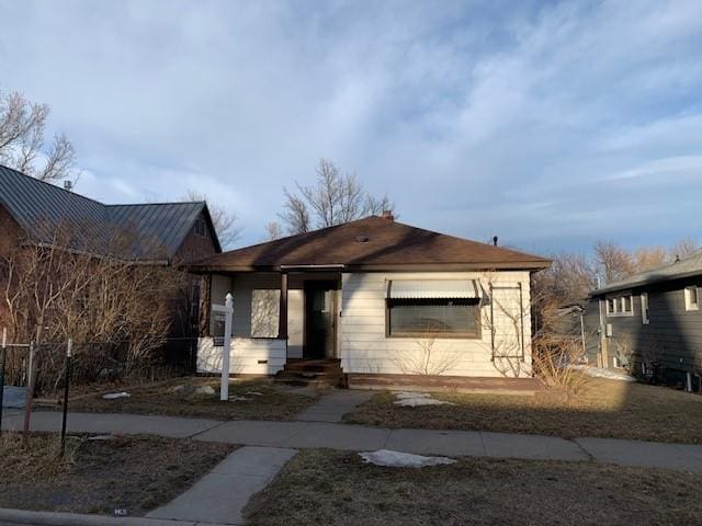 bungalow-style house with entry steps