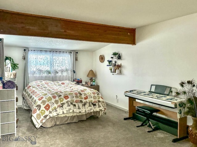 bedroom featuring carpet flooring and beam ceiling