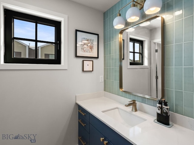 3057 S 31st Ave, Bozeman, MT 59718 - bathroom featuring vanity and healthy amount of natural light