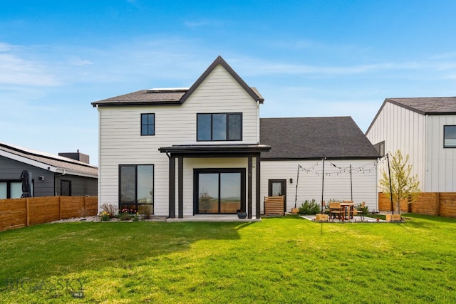3057 S 31st Ave, Bozeman, MT 59718 - back of house featuring a patio, a fenced backyard, and roof with shingles