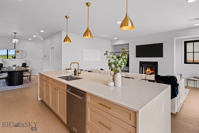 3057 S 31st Ave, Bozeman, MT 59718 - kitchen featuring dishwasher, light wood-type flooring, recessed lighting, open floor plan, and a glass covered fireplace
