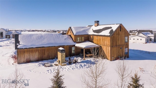 view of snow covered property