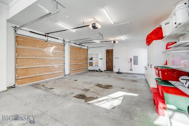 garage featuring a garage door opener and electric panel