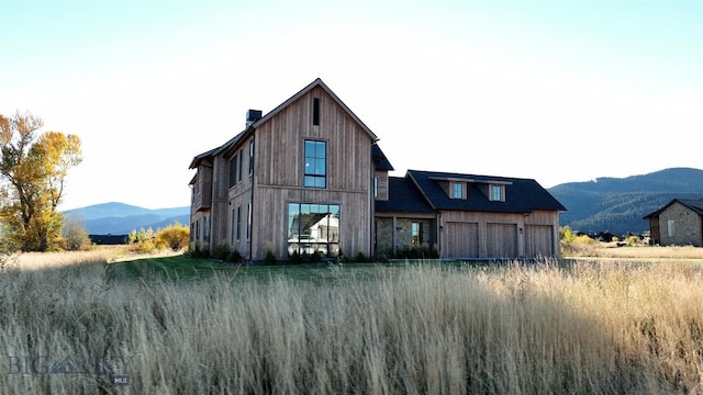 rear view of house with a mountain view