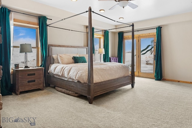 bedroom featuring access to exterior, baseboards, and light carpet