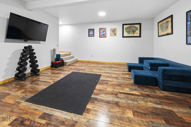 workout area with baseboards, wood finished floors, and recessed lighting