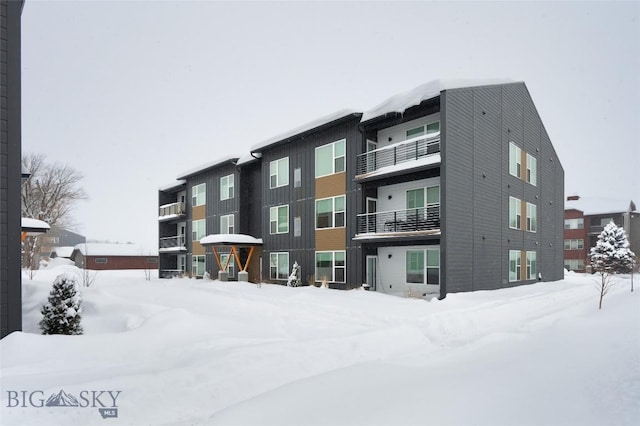 view of snow covered property