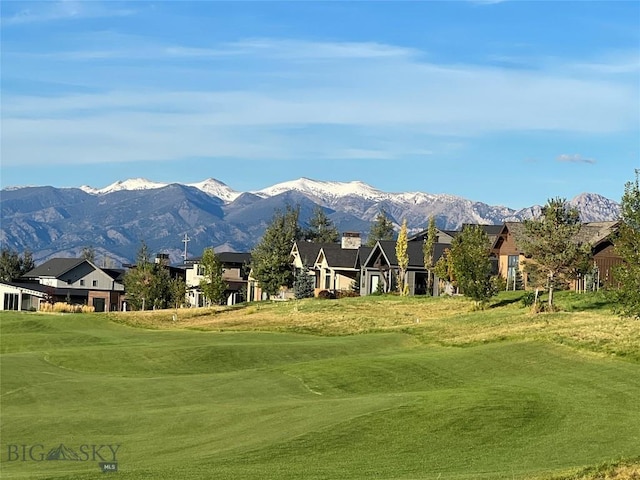 surrounding community with a yard, a residential view, view of golf course, and a mountain view