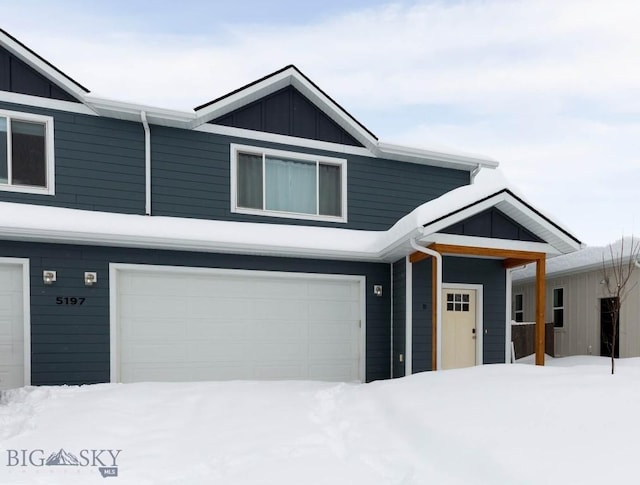 view of front of home featuring board and batten siding and a garage