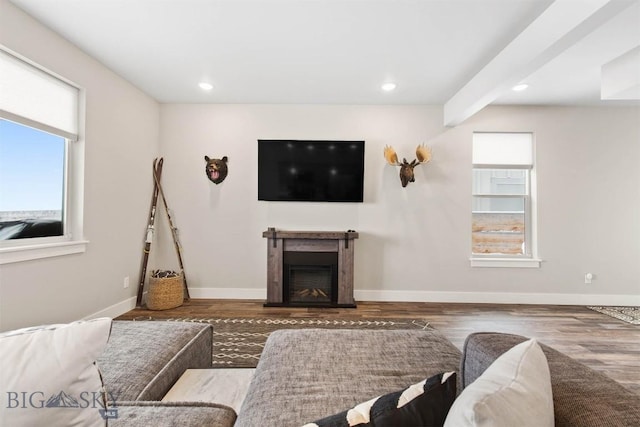 living room with a fireplace, baseboards, dark wood-type flooring, and recessed lighting