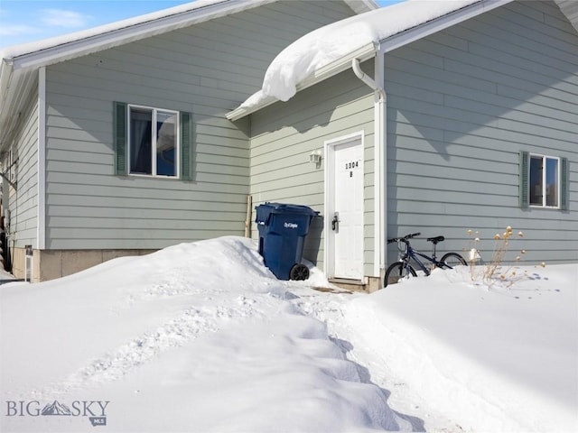 view of snow covered property