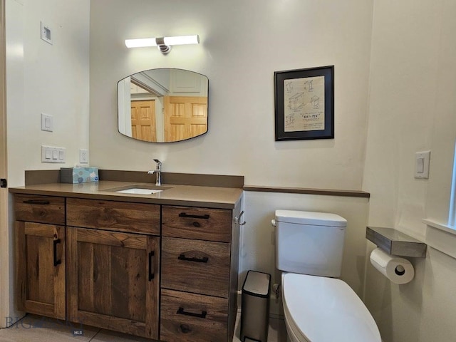 half bath featuring visible vents, vanity, and toilet