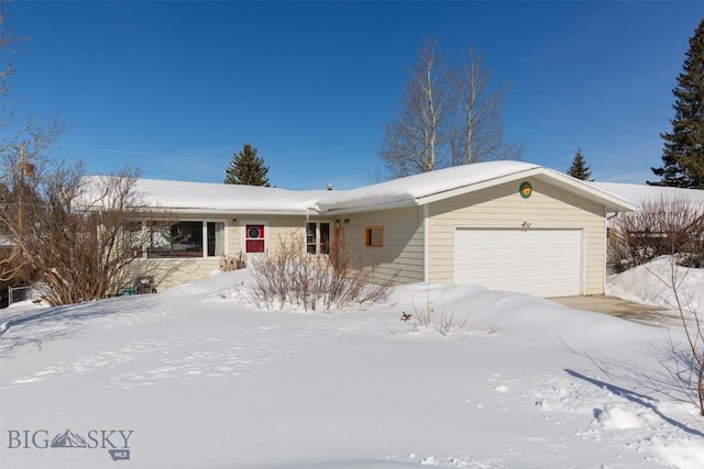 ranch-style house featuring an attached garage