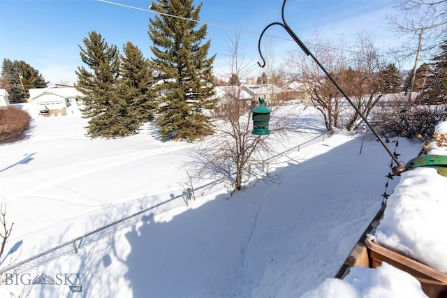 view of yard layered in snow