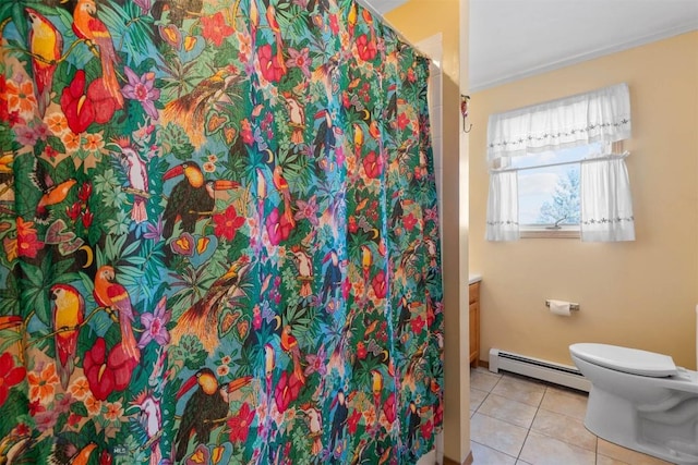 full bath with a baseboard radiator, vanity, toilet, and tile patterned floors