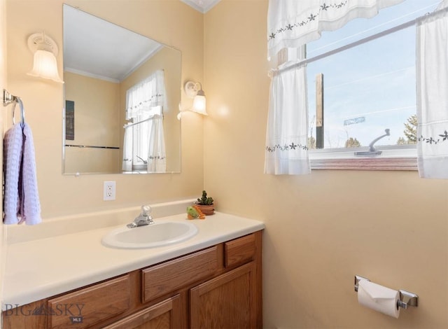 bathroom featuring crown molding and vanity