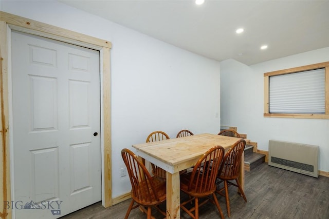 dining room with heating unit, baseboards, dark wood-type flooring, and recessed lighting