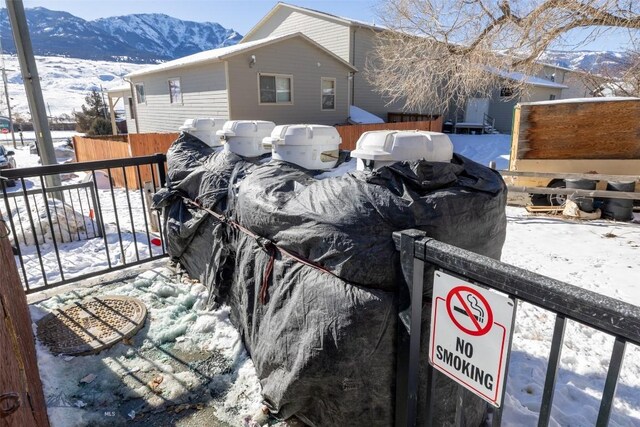 102 Travertine St, Gardiner, MT 59030 - exterior space with fence and a mountain view