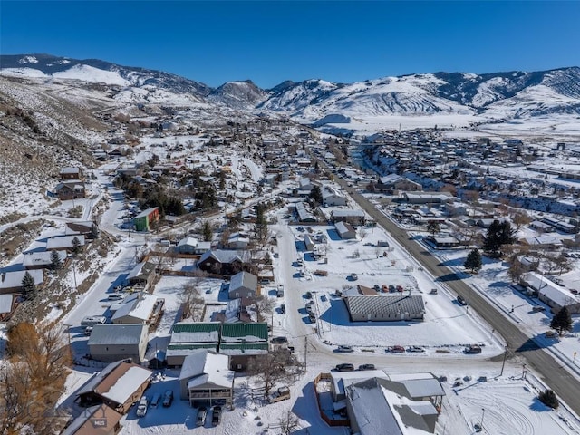 102 Travertine St, Gardiner, MT 59030 - snowy aerial view with a residential view and a mountain view