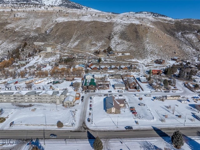 102 Travertine St, Gardiner, MT 59030 - snowy aerial view featuring a mountain view
