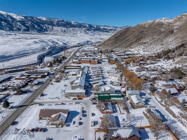 102 Travertine St, Gardiner, MT 59030 - snowy aerial view with a residential view and a mountain view