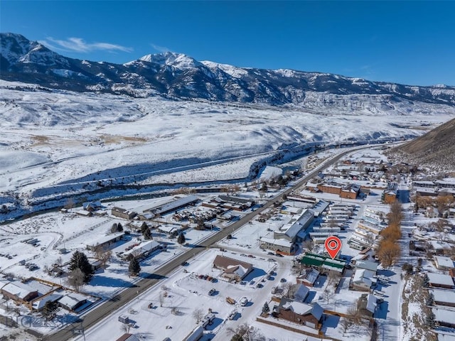102 Travertine St, Gardiner, MT 59030 - snowy aerial view featuring a mountain view