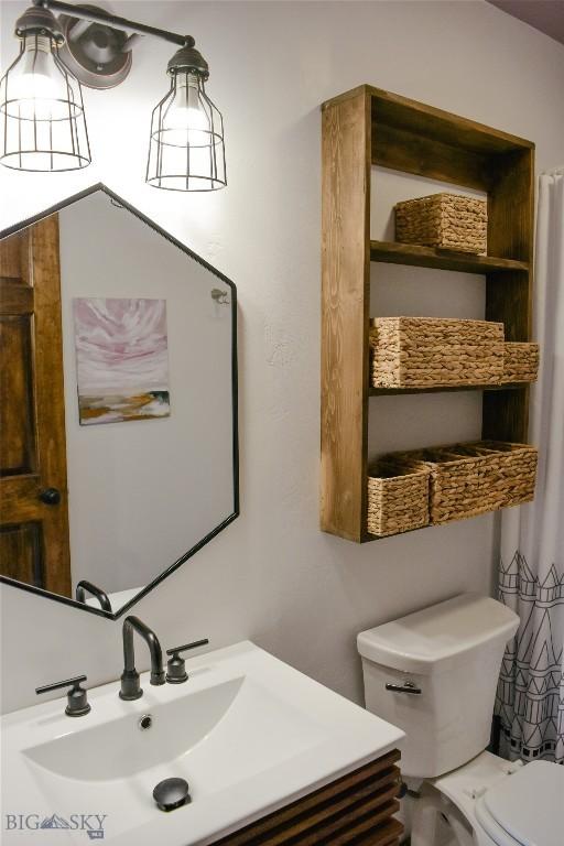 bathroom with vanity and toilet