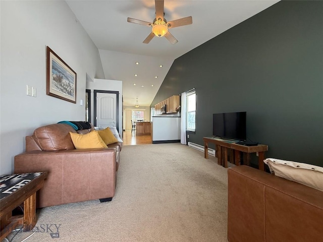 living area with light carpet, baseboards, a ceiling fan, vaulted ceiling, and baseboard heating