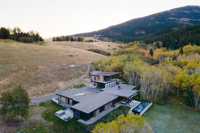 bird's eye view featuring a rural view and a mountain view