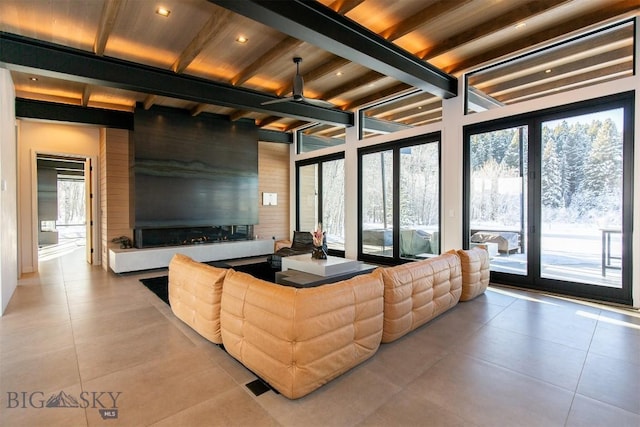 living area with recessed lighting, beamed ceiling, and light tile patterned floors