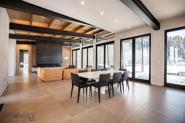 dining area featuring recessed lighting, beamed ceiling, and french doors