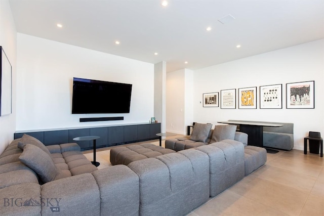 living area featuring light tile patterned floors and recessed lighting