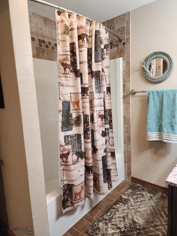 bathroom featuring shower / bathtub combination with curtain and vanity