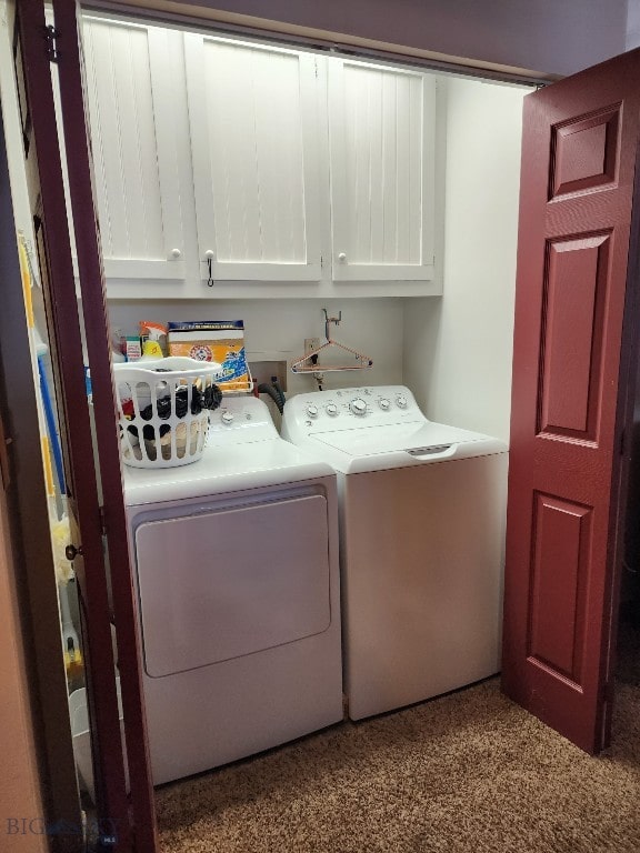 laundry area featuring cabinet space and washing machine and clothes dryer