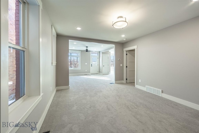 empty room with light carpet, baseboards, visible vents, and recessed lighting