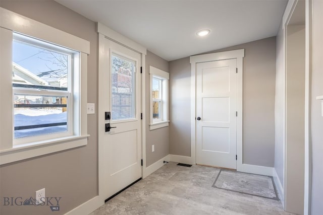 entryway featuring baseboards