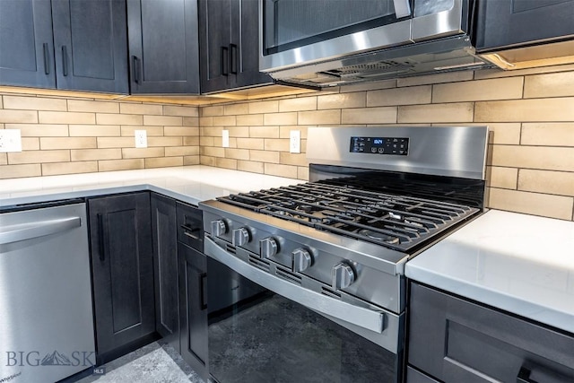 kitchen featuring stainless steel appliances, light countertops, and tasteful backsplash