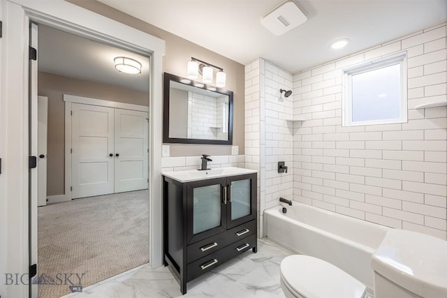 full bath with toilet, marble finish floor, vanity, and bathing tub / shower combination