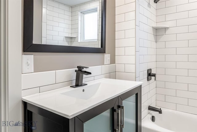 full bathroom with a sink, shower / bathing tub combination, and decorative backsplash