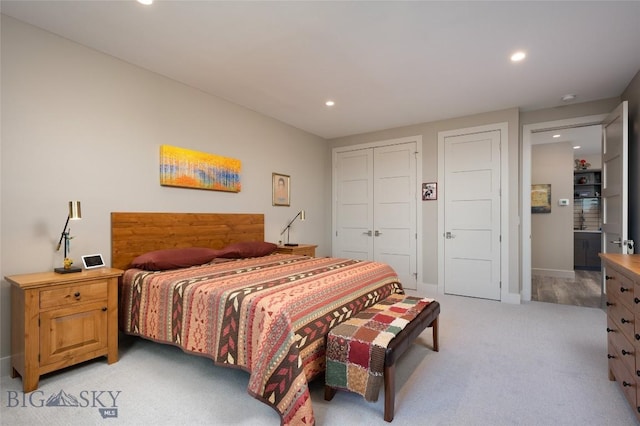 bedroom with light carpet, baseboards, a closet, and recessed lighting