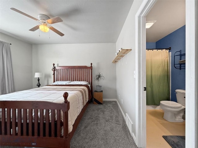 bedroom with visible vents, baseboards, dark colored carpet, and a ceiling fan